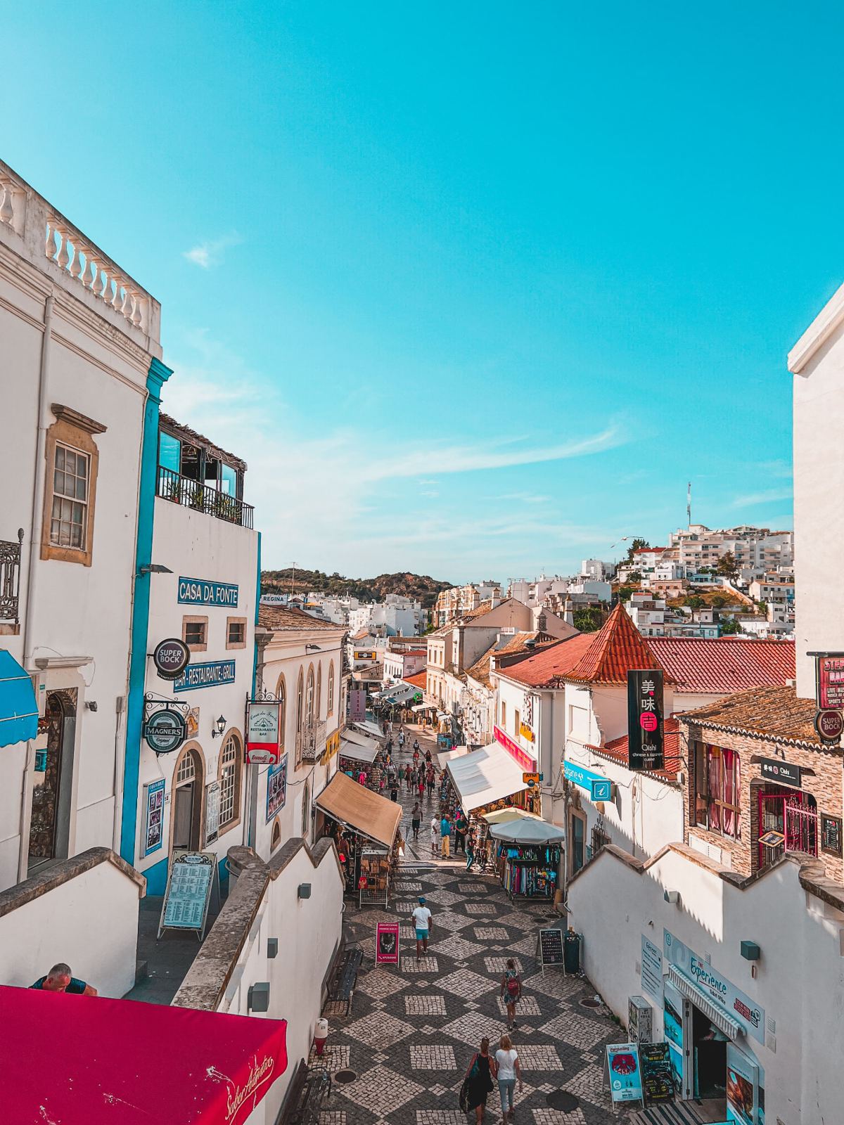 Turquoise coastal town with whitewashed buildings