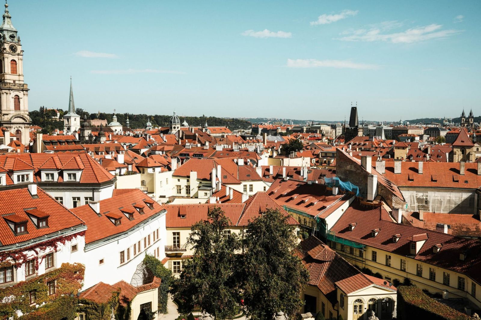 Panoramic view over the historic red rooftops of Prague